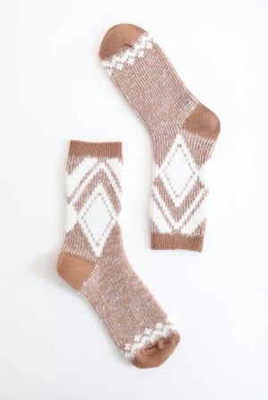 Pair of brown and white patterned socks on a white background