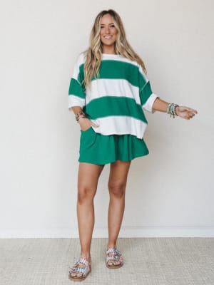 A bright, happy matching set in bold green and white stripes — the oversized top and pull-on shorts feel like the kind of outfit you throw on and somehow look totally put-together in.